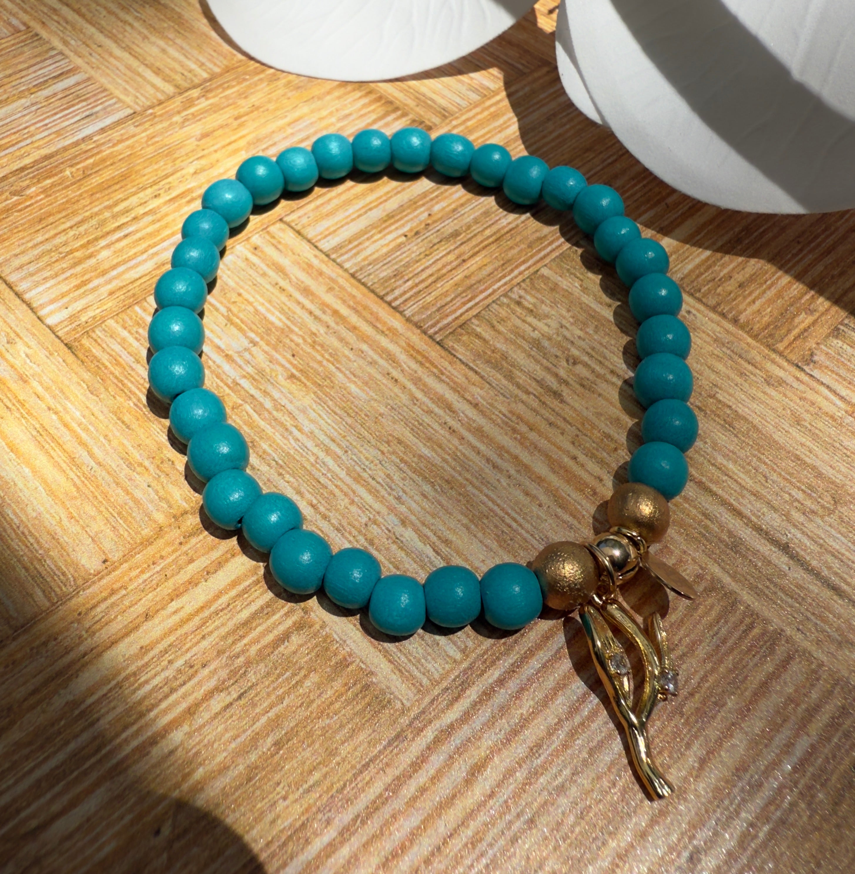 Turquoise colored Wooden Bead Slip-on Style Bracelet with Sea Kelp Charm