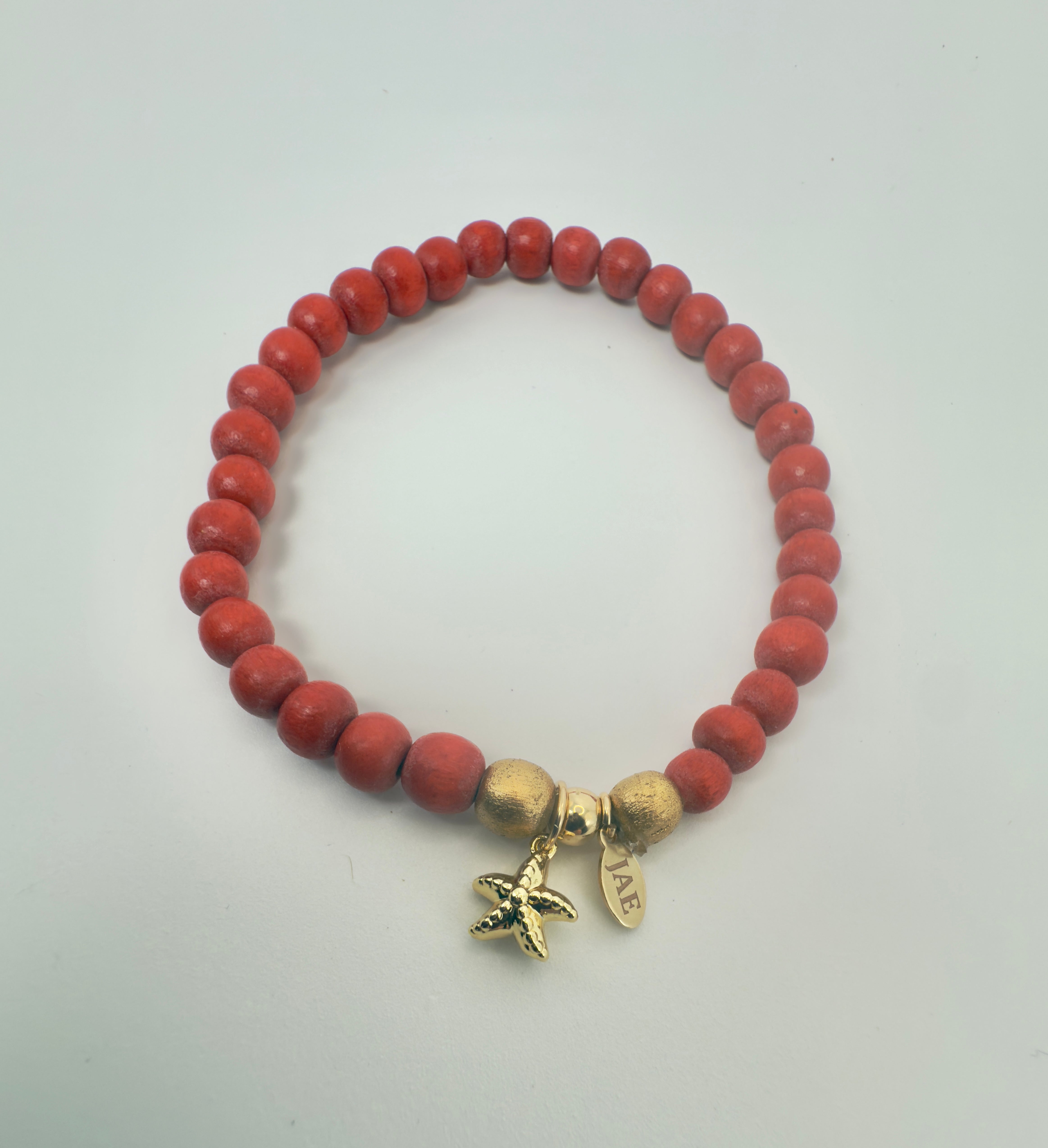 Dark Orange Wood Bead Slip-on Style Bracelet with Starfish Charm