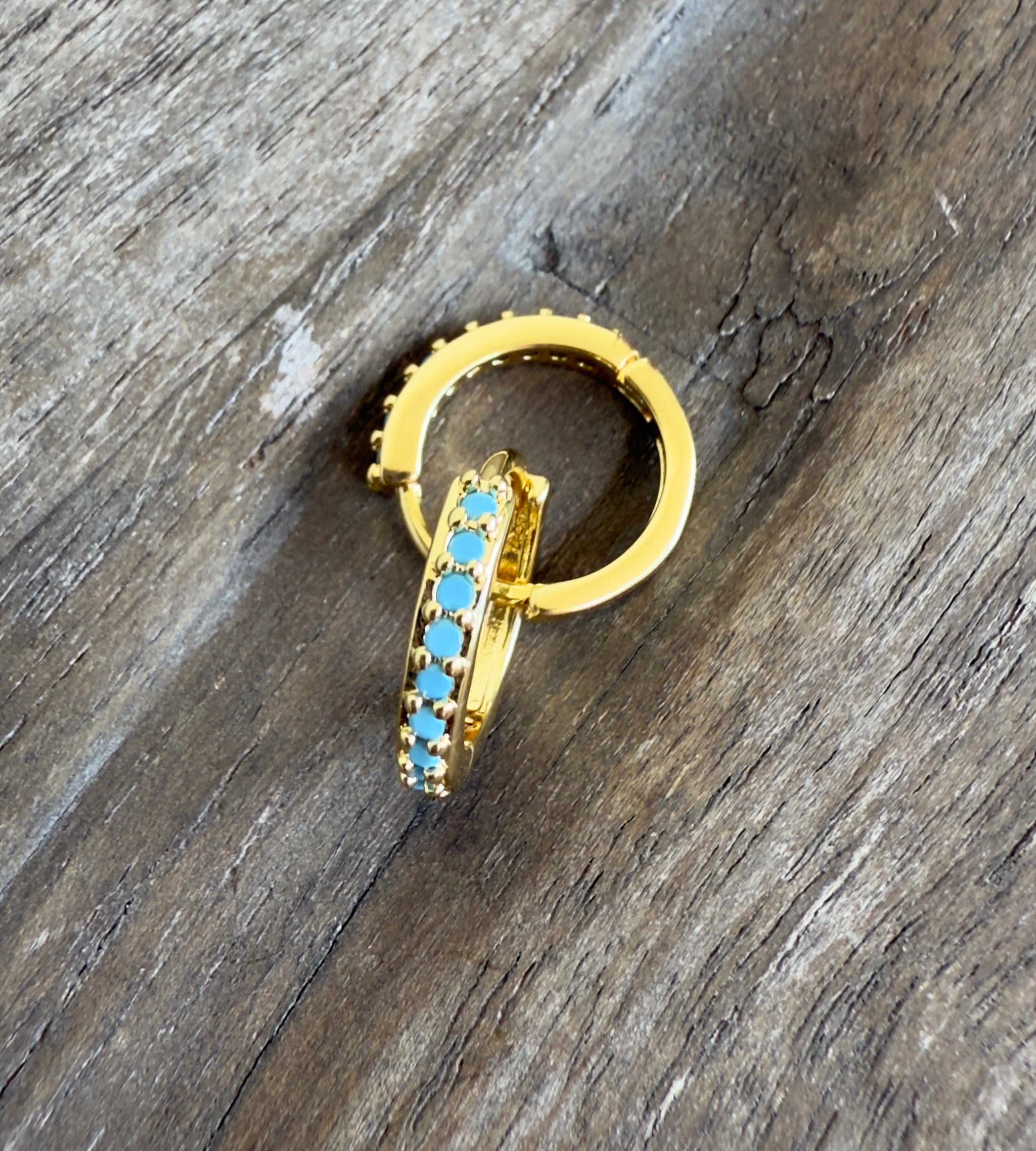 The Luca  - Huggie Style Hoop Earrings with Turquoise Colored Cubic Zirconia Accents