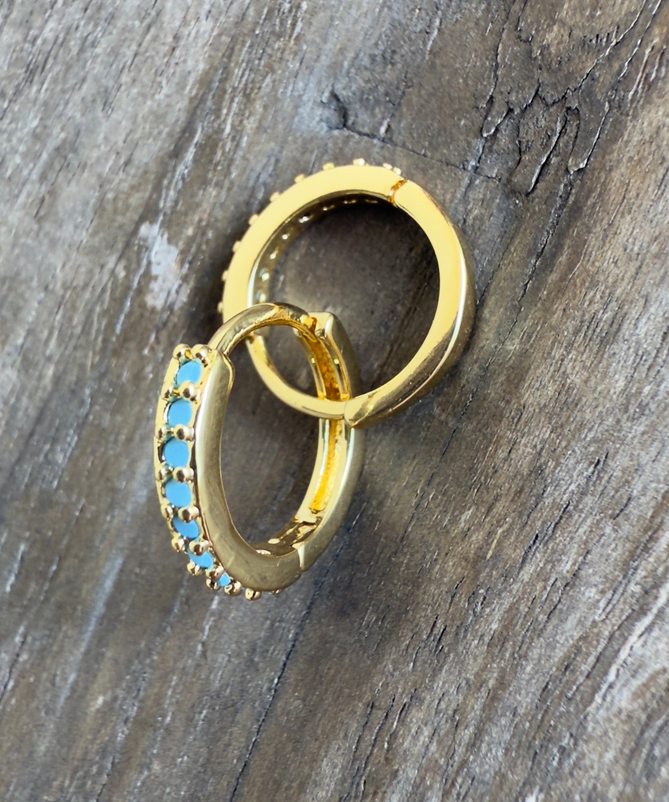 The Luca  - Huggie Style Hoop Earrings with Turquoise Colored Cubic Zirconia Accents